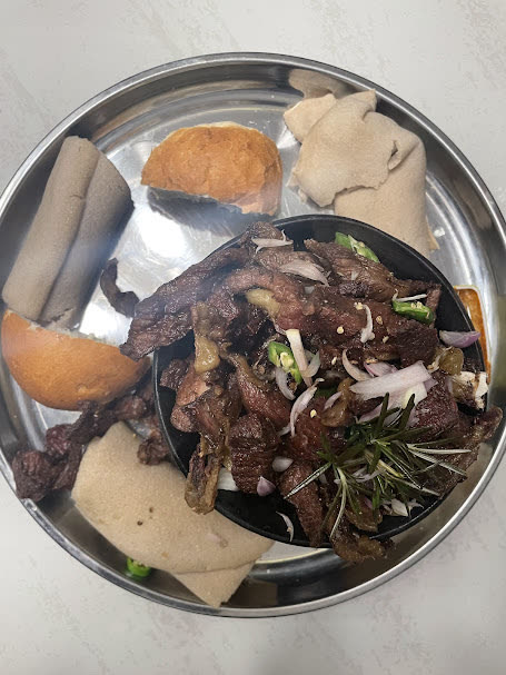 A home-cooked meal of meat, greens and chapati