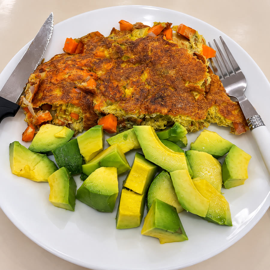 A home-cooked omelette with avocado prepared by an Eat Better UG member